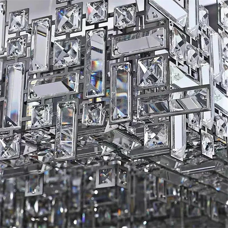 Modern decorbites crystal chandelier with geometric clear crystals and metallic frame for luxury living spaces