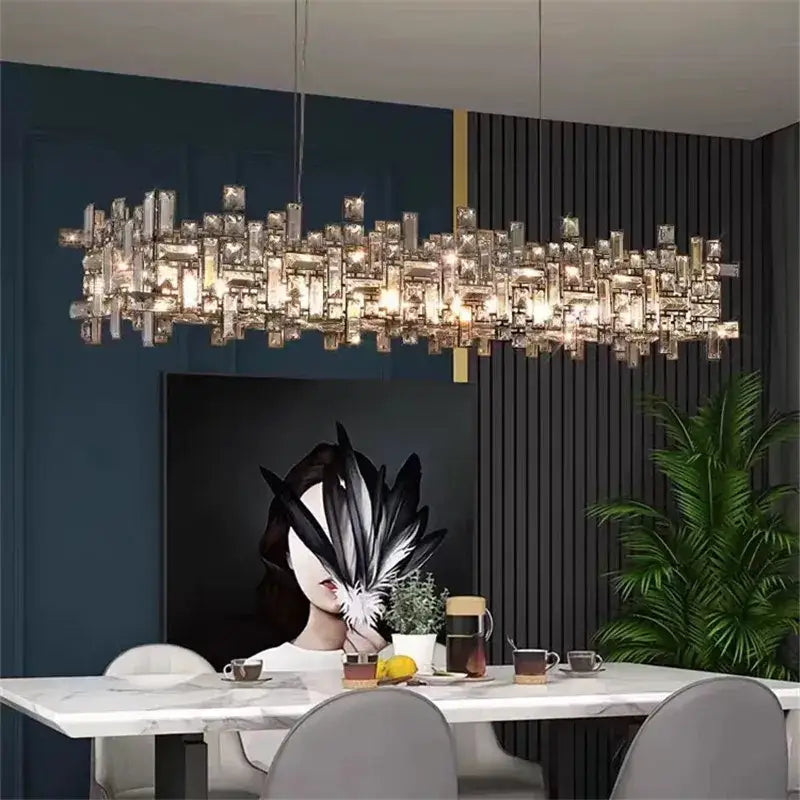 A modern decorbites crystal chandelier with clear crystal prisms in a rectangular cascading design for luxury lighting