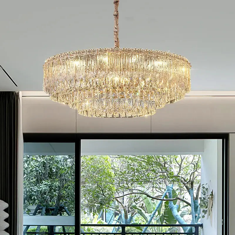 A decorbites crystal chandelier with a rose gold finish and cascading clear and golden crystals for luxury lighting