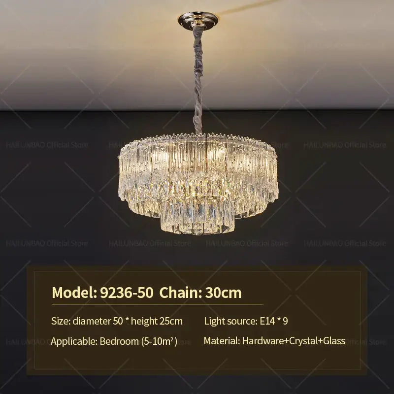 Elegant two-tiered decorbites crystal chandelier with polished brass fixture and clear glass prisms for luxury room lighting