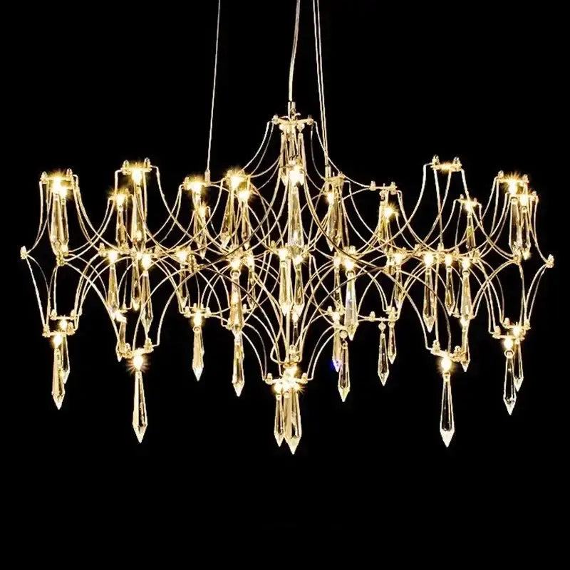 A dazzling gold-toned decorbites crystal chandelier with intricate metal arms and hanging crystal pendants for luxury decor
