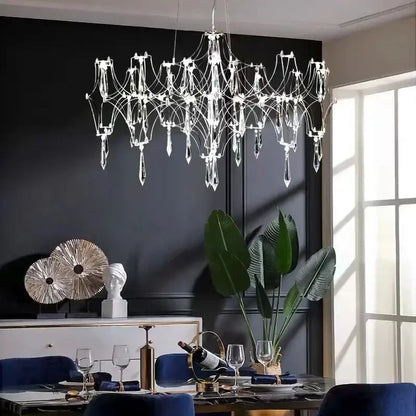 A decorbites crystal chandelier with a metallic frame and clear glass prisms for luxury modern living spaces