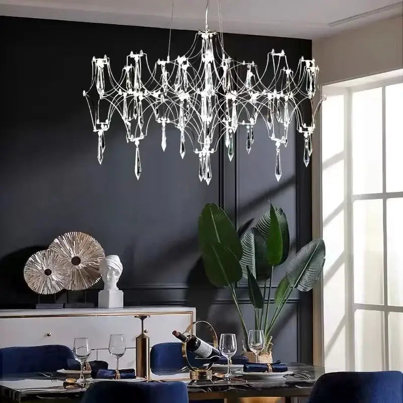 A decorbites crystal chandelier with a metallic frame and clear glass prisms for luxury modern living spaces