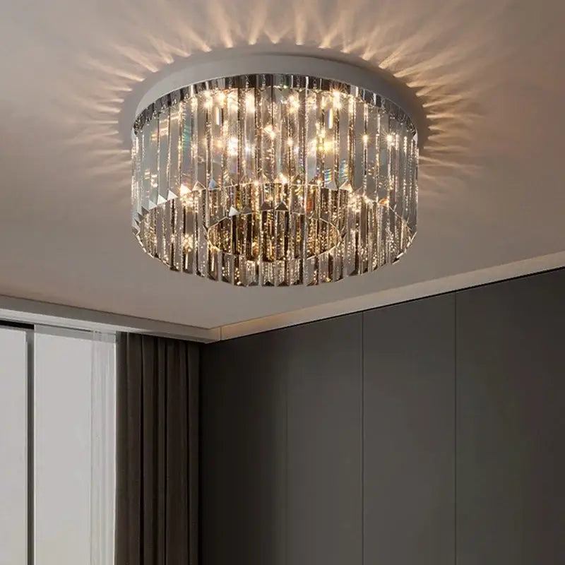 DecorBites crystal chandelier ceiling light with cascading clear crystal prisms and sleek metallic rim for luxury decor