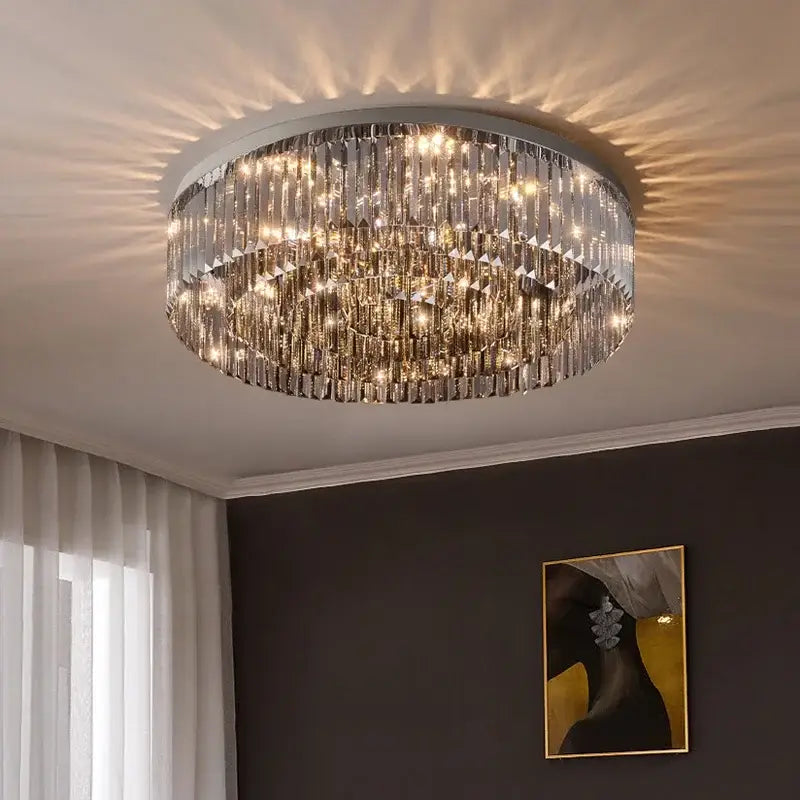 Circular decorbites crystal chandelier ceiling light with multiple tiers of faceted glass rods and warm-toned lighting
