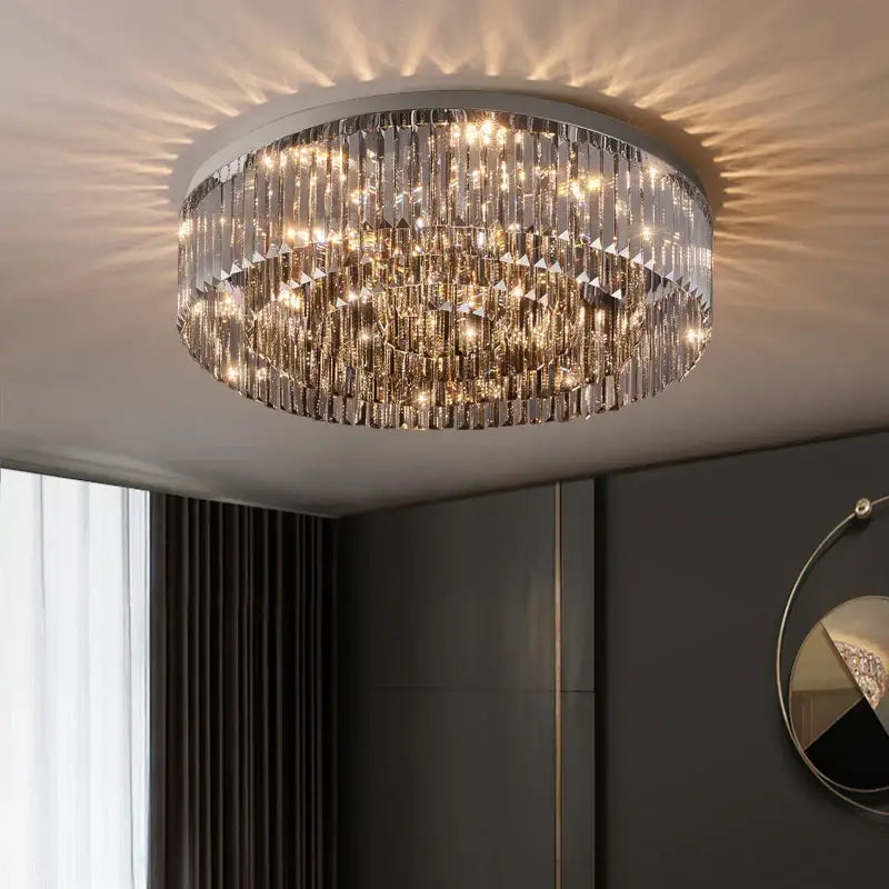 A decorbites crystal chandelier featuring cascading clear faceted crystal prisms on a metallic frame for luxury interiors