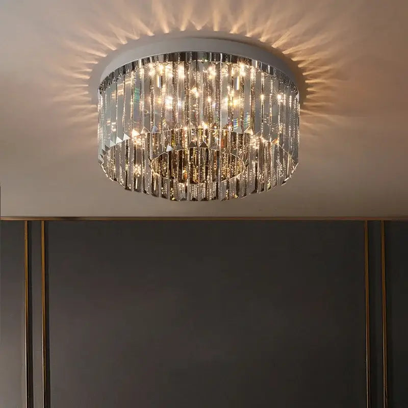 Circular ceiling light with cascading clear crystal prisms and white metal frame decorbites crystal chandelier for interiors