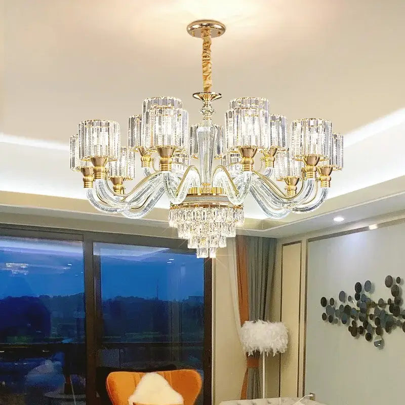 Elegant decorbites crystal chandelier with gold-toned metal accents and cascading glass prisms for luxury home lighting