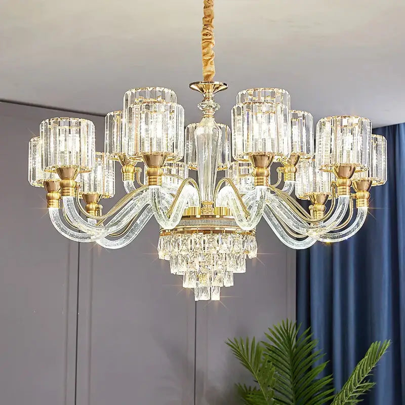 Elegant gold-toned decorbites crystal chandelier with cascading glass prisms for luxury living room and bedroom lighting