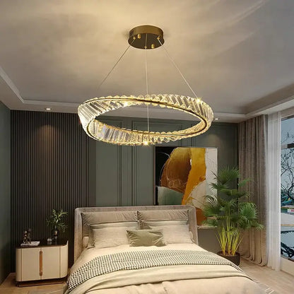 A decorbites crystal chandelier with a gold-toned metal frame and faceted crystal accents for living room and bedroom