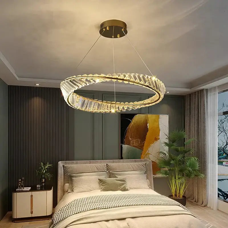 A decorbites crystal chandelier with a gold-toned metal frame and faceted crystal accents for living room and bedroom