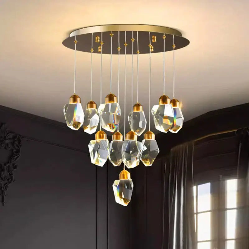 Decorbites crystal chandelier with gold circular mount and faceted glass pendants for living and dining room lighting