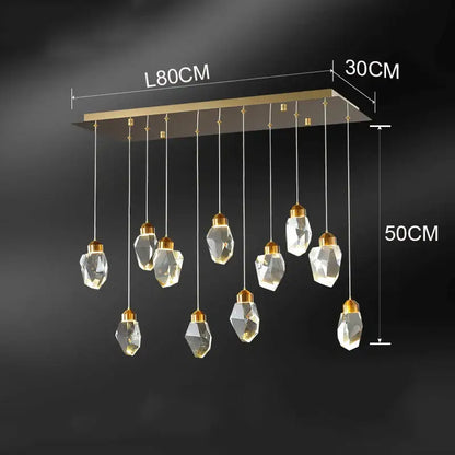 Modern decorbites crystal chandelier with gold-toned rectangular frame and faceted glass pendants for living room lighting
