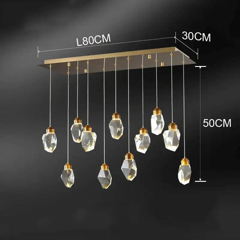 Modern decorbites crystal chandelier with gold-toned rectangular frame and faceted glass pendants for living room lighting