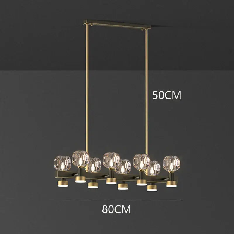 Gold-toned decorbites crystal chandelier with eight faceted crystal globe lights for living and dining room luxury pendant light