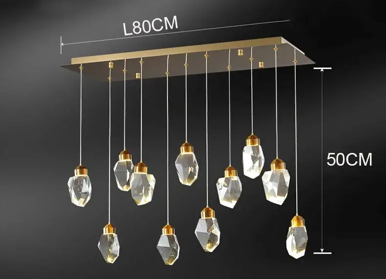 A modern decorbites crystal chandelier with gold-toned metal frame and ten faceted crystal pendants for living room