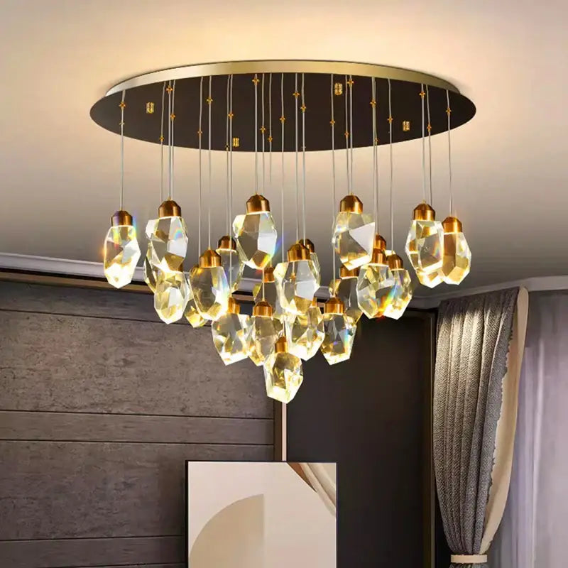 Decorbites crystal chandelier featuring faceted golden glass pendants on a circular brass frame for living room lighting