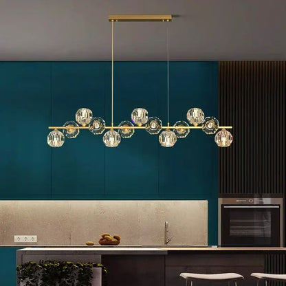 Gold-toned decorbites crystal chandelier with faceted crystal globe pendants for living and dining room luxury lighting