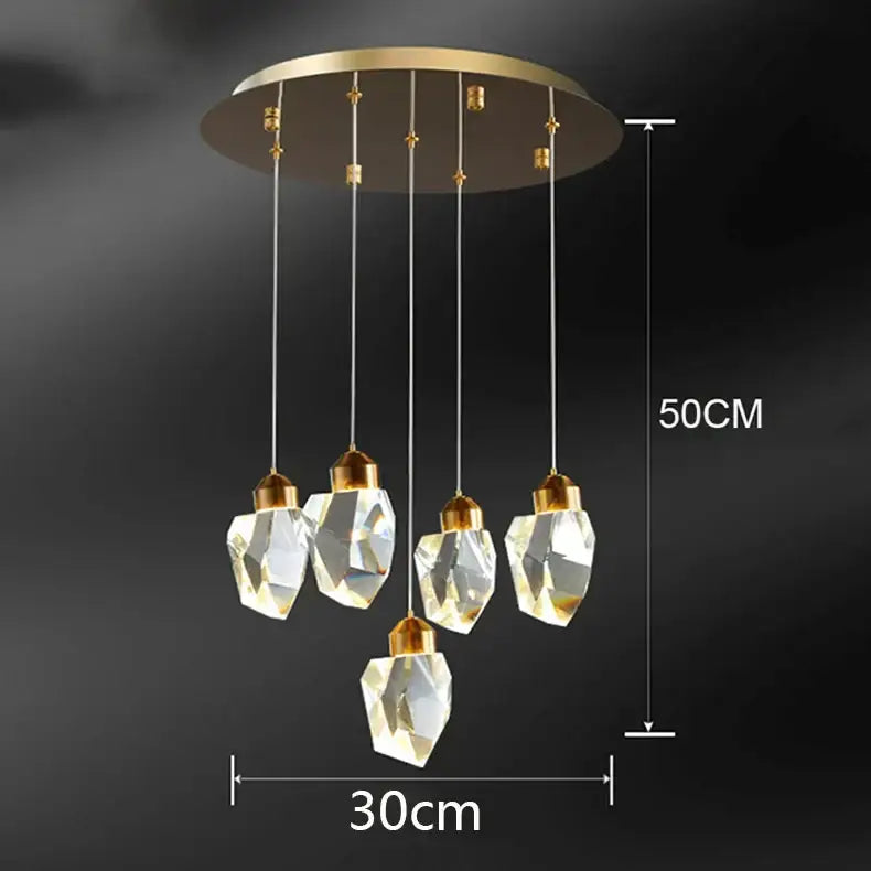 A modern DecorBites crystal chandelier with five clear glass pendants and a gold-toned ceiling mount for living room