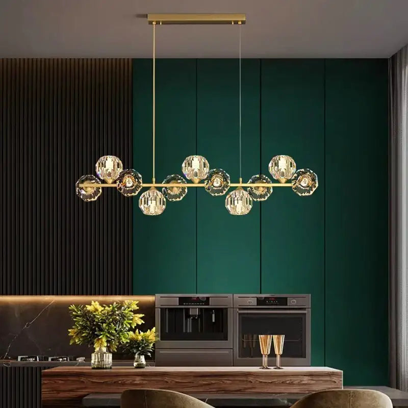 Gold-toned DecorBites crystal chandelier with multiple faceted crystal globe pendants for living and dining rooms