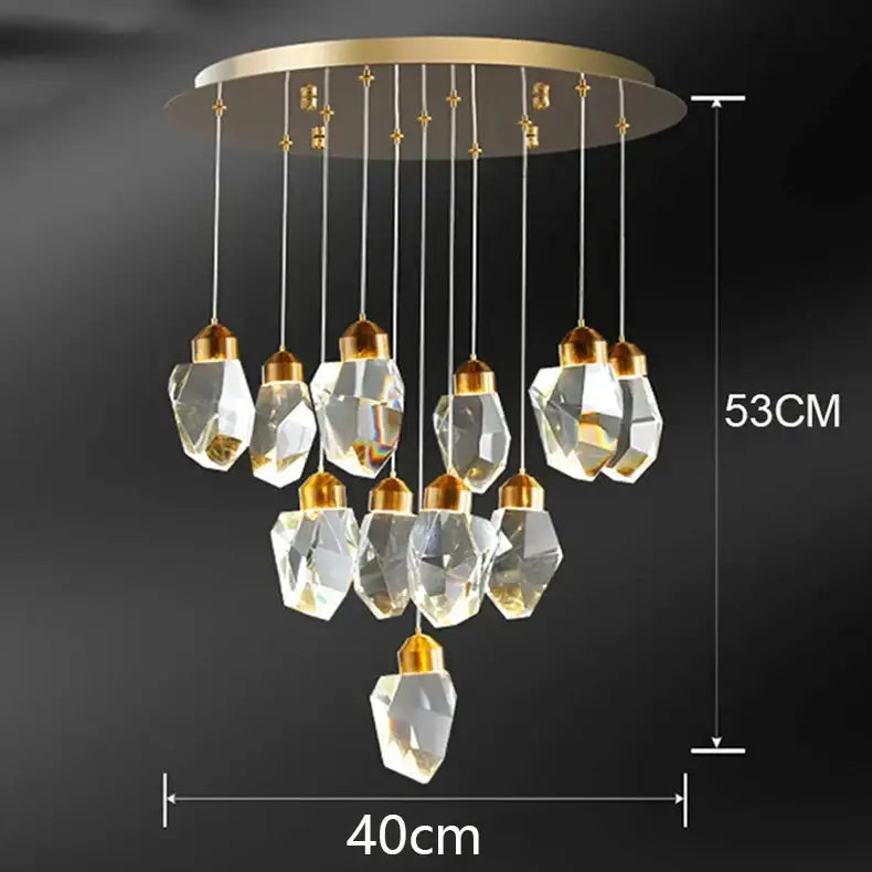 A decorbites crystal chandelier with gold-toned mount and faceted clear glass pendants for living and dining rooms