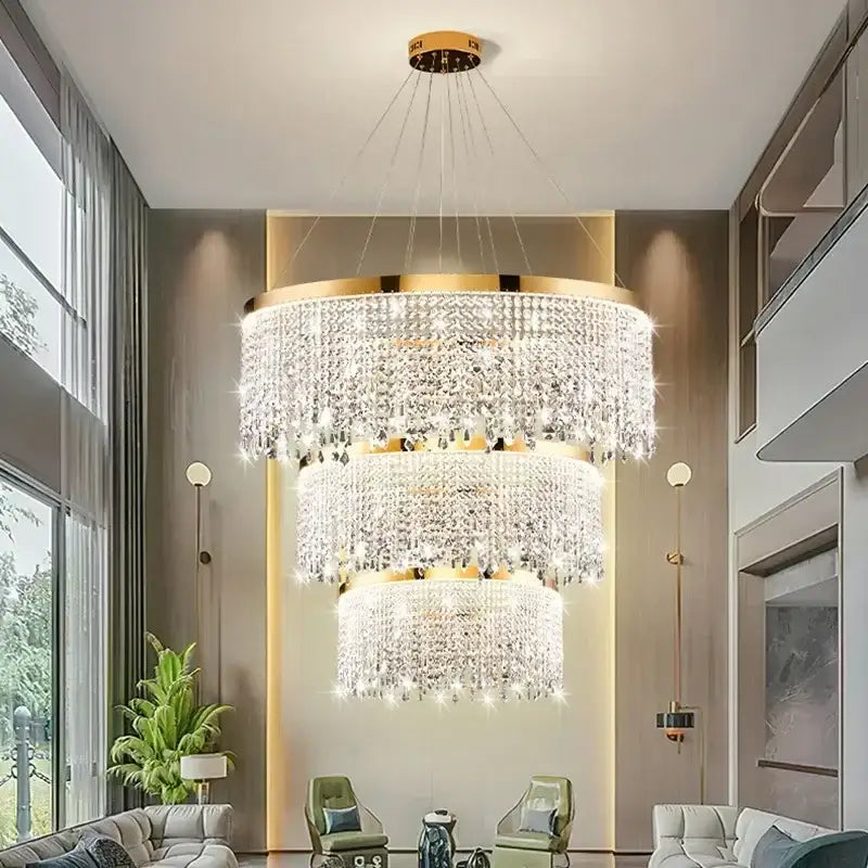 A decorbites crystal chandelier with cascading clear crystal droplets and a polished gold-toned frame for living rooms