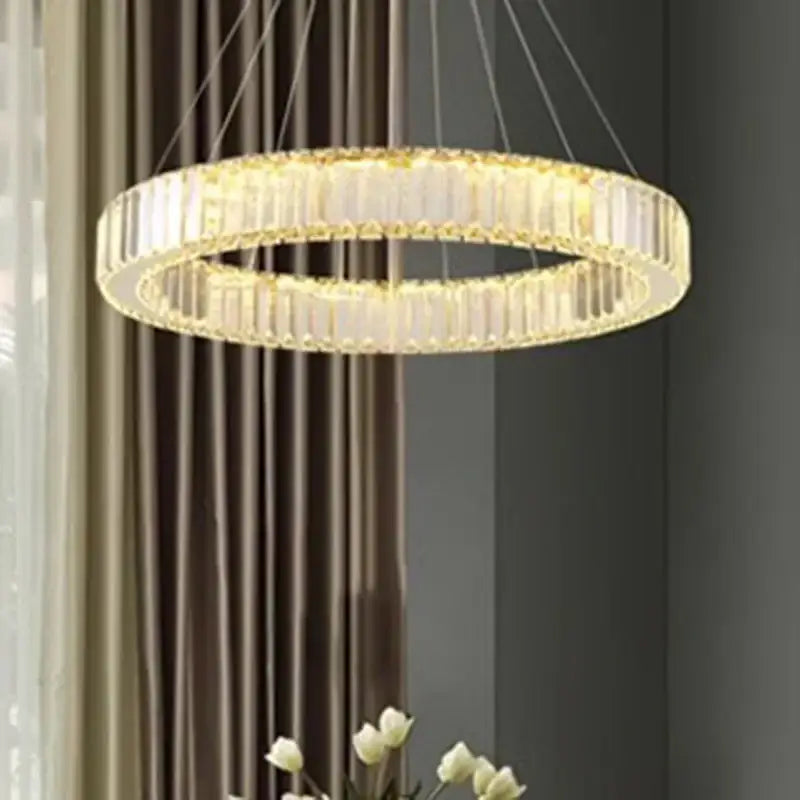 A modern decorbites crystal chandelier with faceted crystals and warm LED lighting for living rooms and staircases