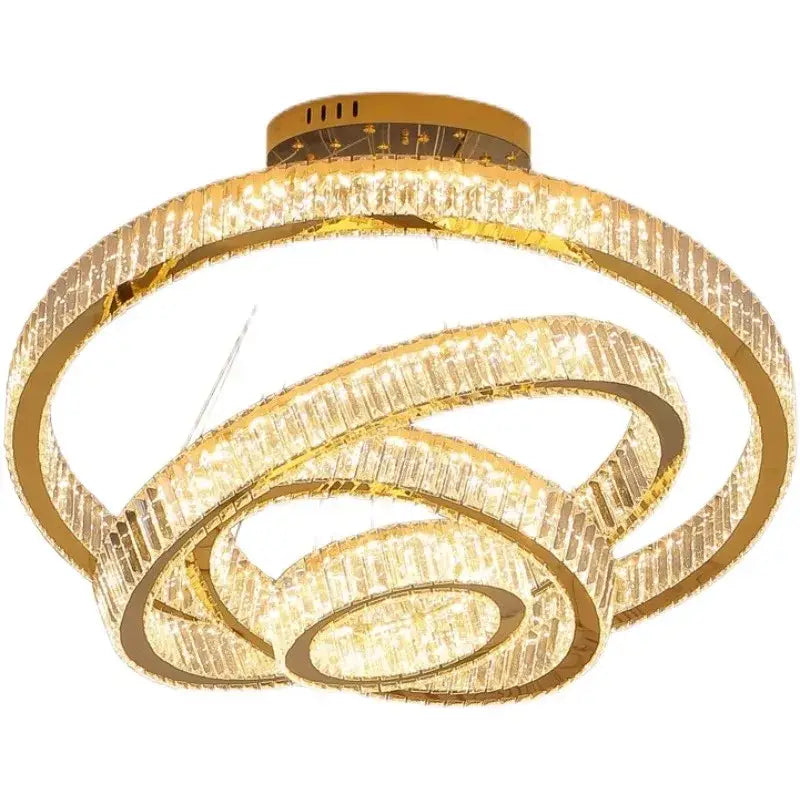 Gold-toned decorbites crystal chandelier with interlocking rings and clear faceted crystals for living room lighting