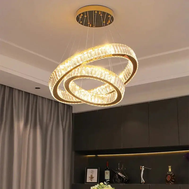 A modern decorbites crystal chandelier with double crystal-encrusted rings and gold-toned metal for living rooms