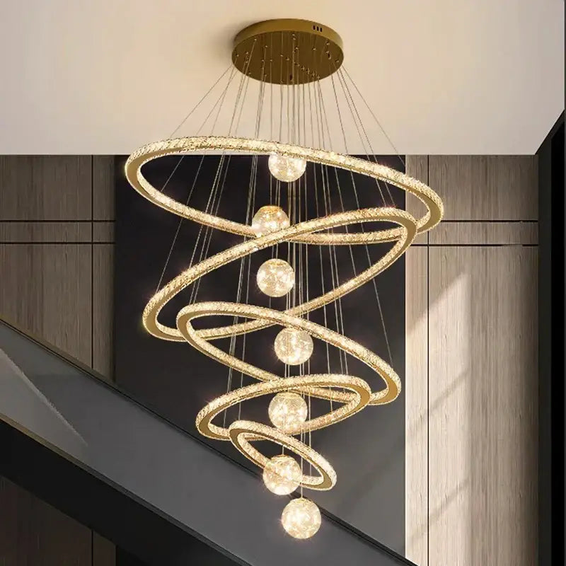 Golden spiral decorbites crystal chandelier with crystal-encrusted rings and spherical light fixtures for indoor lighting