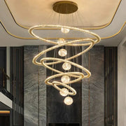 Golden spiral decorbites crystal chandelier with crystal-encrusted rings and spherical lights for indoor lighting