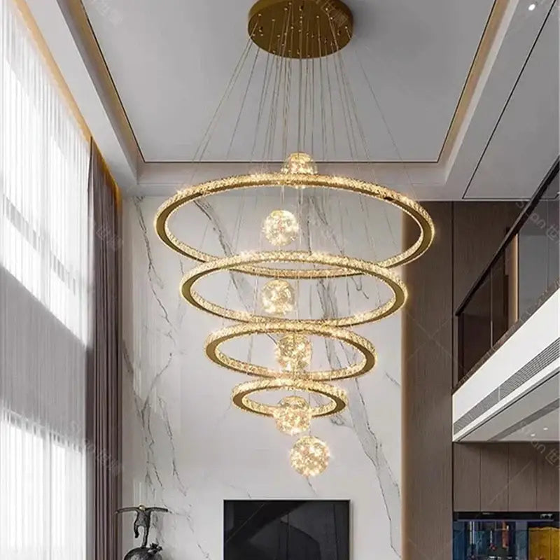 A modern decorbites crystal chandelier with multi-tiered gold rings and sparkling crystals for luxury indoor lighting
