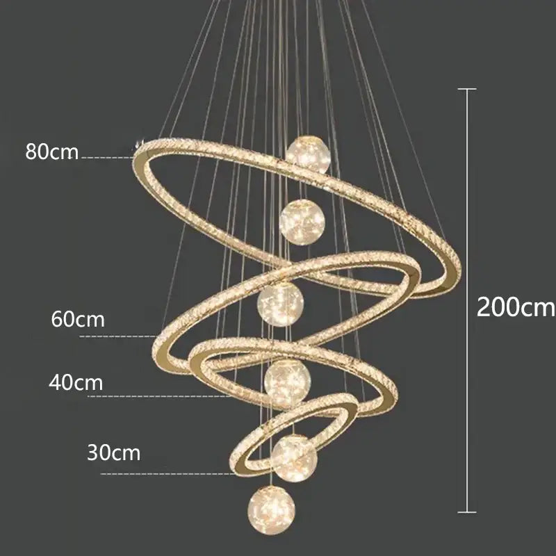 Decorbites crystal chandelier with golden spiral design, embedded crystals, and spherical light fixtures for indoor lighting