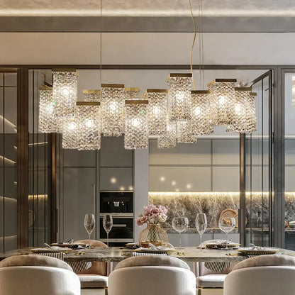 A decorbites crystal chandelier featuring multiple rectangular crystal-encrusted lights on a gold-toned frame