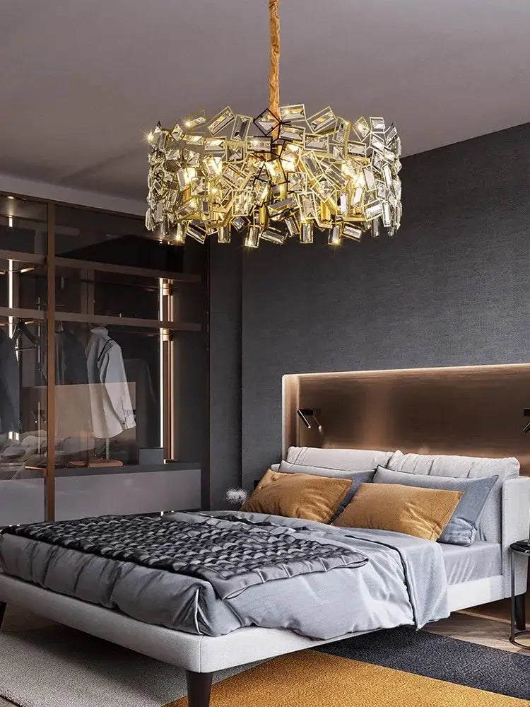 DecorBites crystal chandelier with golden frame and faceted clear crystals in an asymmetrical modern design