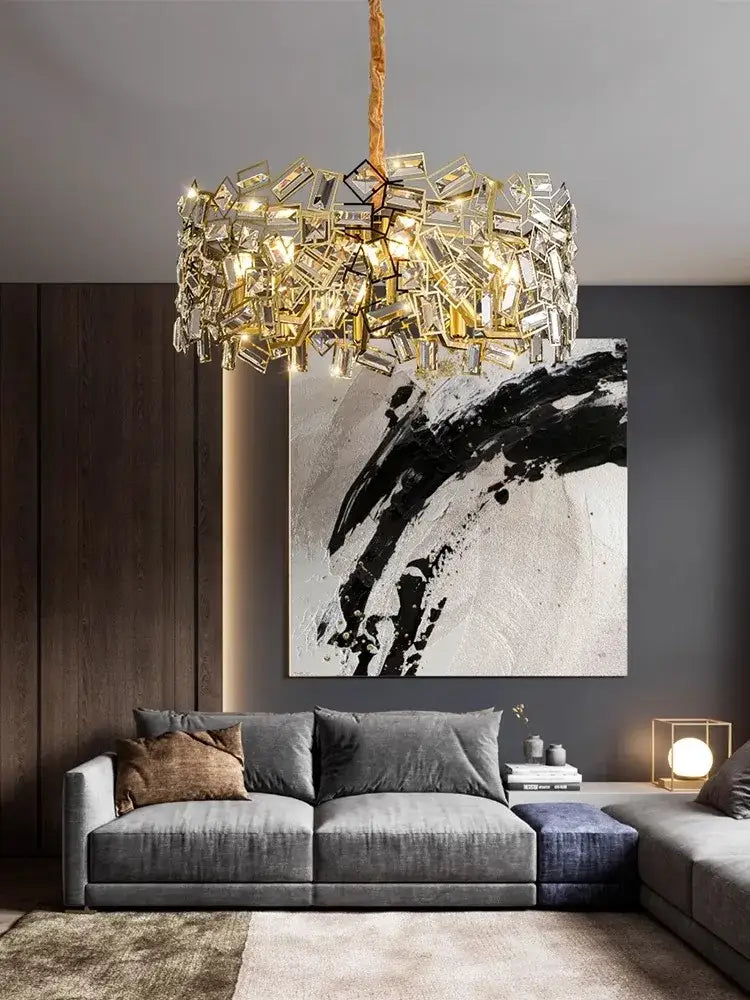 Gold-toned decorbites crystal chandelier with geometric faceted pieces suspended from textured rope for modern lighting