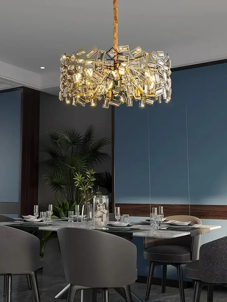 A decorbites crystal chandelier with a golden frame and clear faceted crystals for modern bedroom lighting