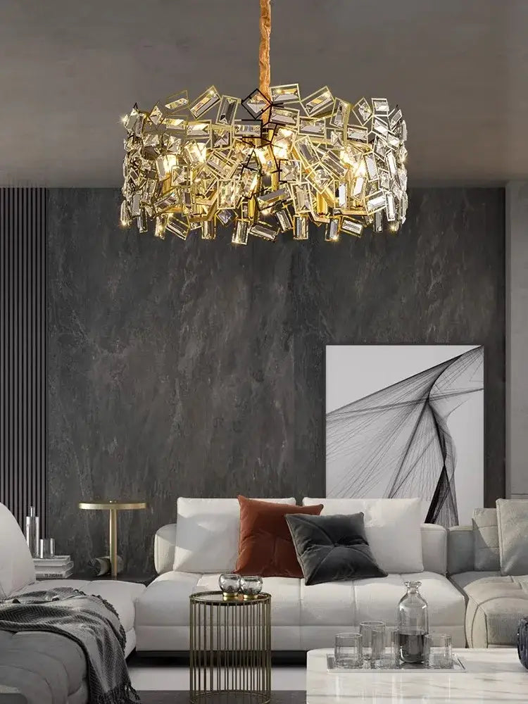 Gold-toned DecorBites crystal chandelier with faceted rectangular crystals suspended from a textured cord for modern lighting