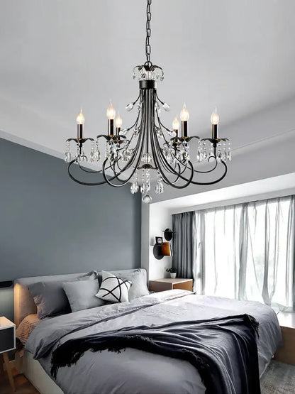 Black wrought iron decorbites crystal chandelier with candle-style bulbs and dangling crystal droplets for living room