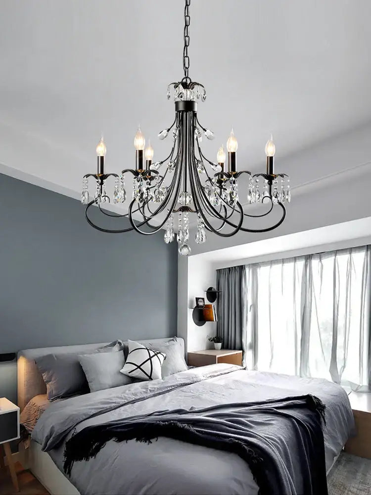 Black wrought iron decorbites crystal chandelier with candle-style bulbs and dangling crystal droplets for living room