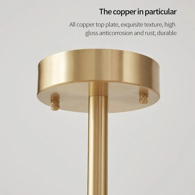 Gold-finished copper decorbites crystal chandelier with sleek cylindrical design and polished top plate for living spaces