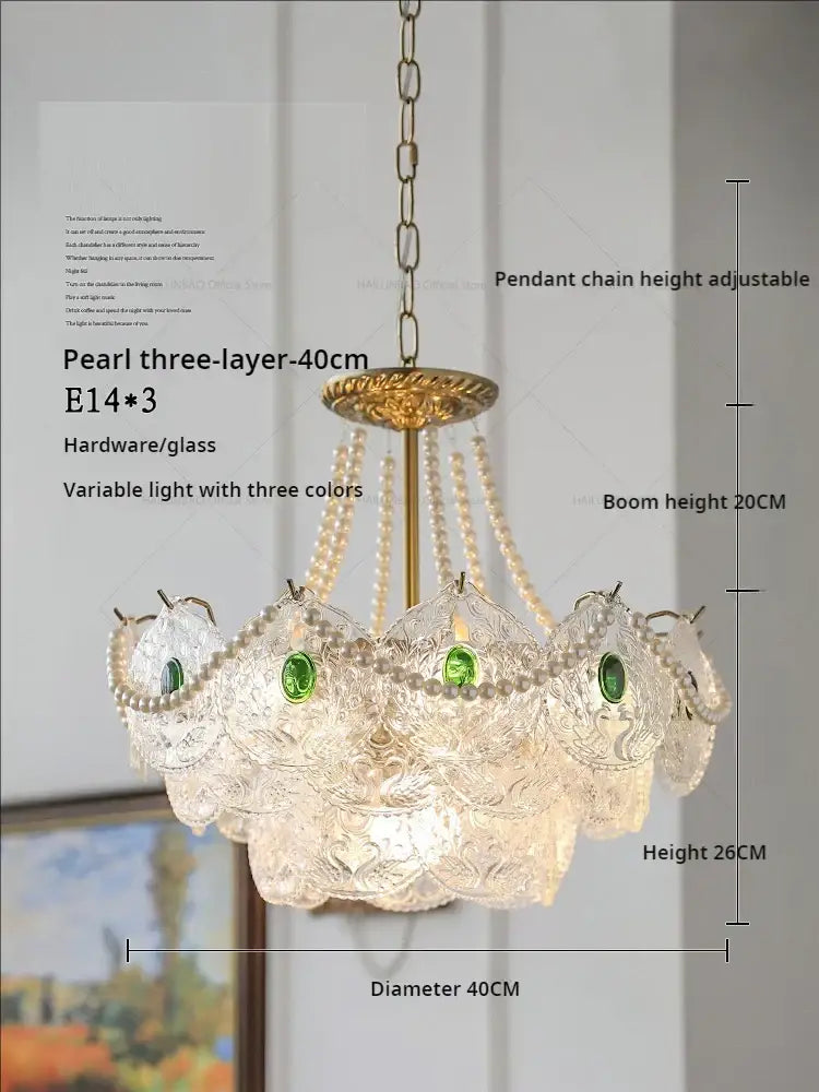 Elegant three-layer crystal chandelier with pearls clear glass shades and green gemstone accents by decorbites crystal chandelier