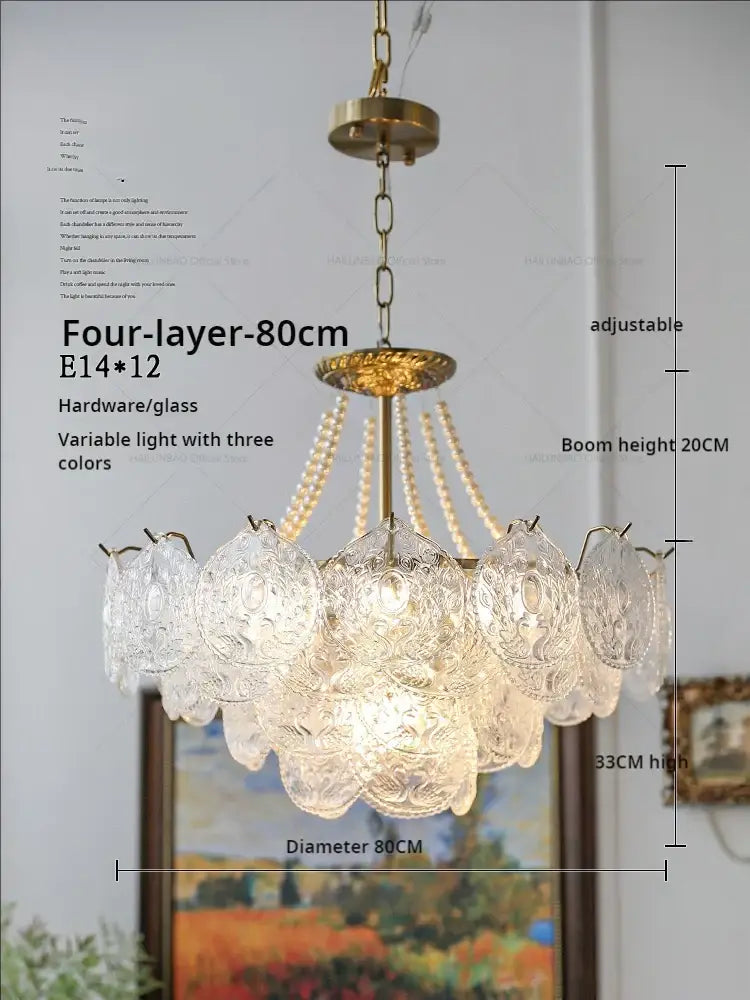 Elegant four-layer decorbites crystal chandelier with clear glass, gold-toned metal frame, and adjustable chain for home decor