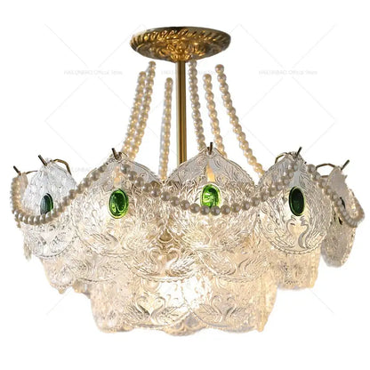 Elegant decorbites crystal chandelier with clear etched glass, green gemstones, and cream pearl strands for chic decor