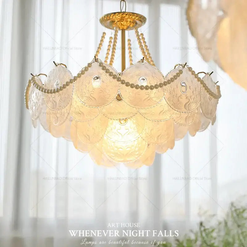 Decorbites crystal chandelier with gold-toned frame translucent scalloped glass panels and beaded chains for elegant decor