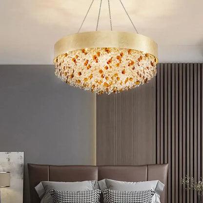 Gold-toned decorbites crystal chandelier with cascading amber and clear crystal beads for living room or kitchen island