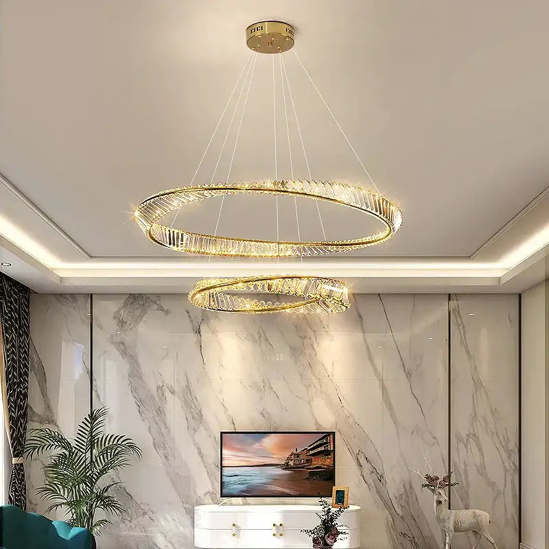 Gold-toned double-ring decorbites crystal chandelier with crystal accents for luxurious living room and dining room lighting