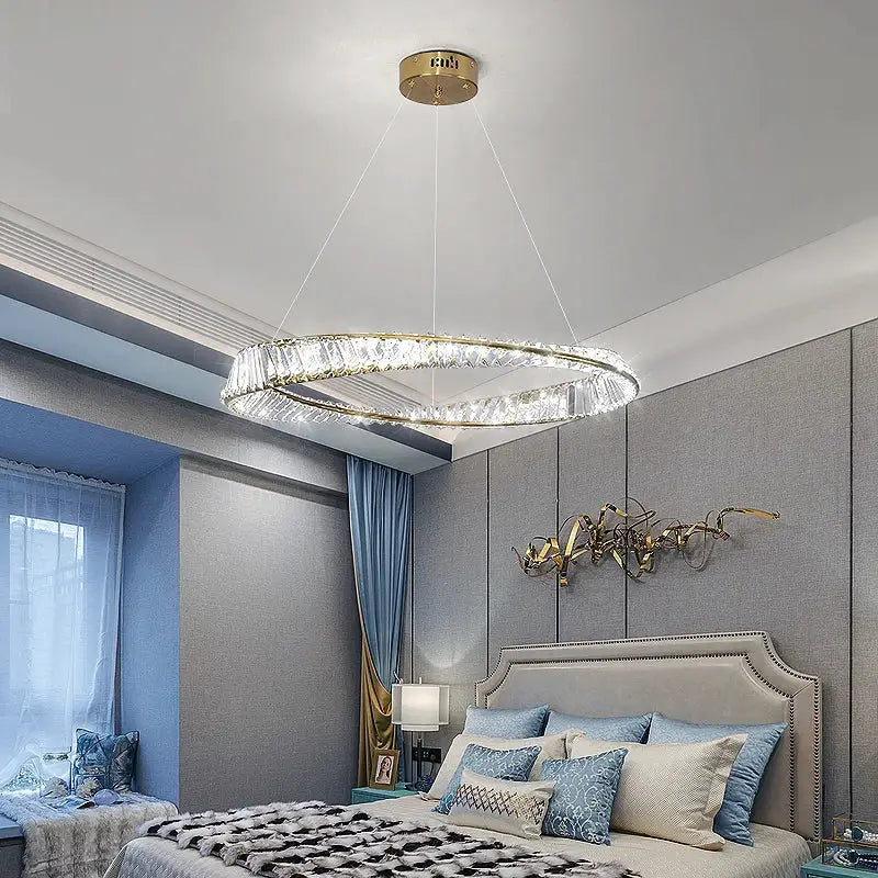 Decorbites crystal chandelier featuring a modern circular gold-toned frame with embedded crystal elements for luxury living rooms