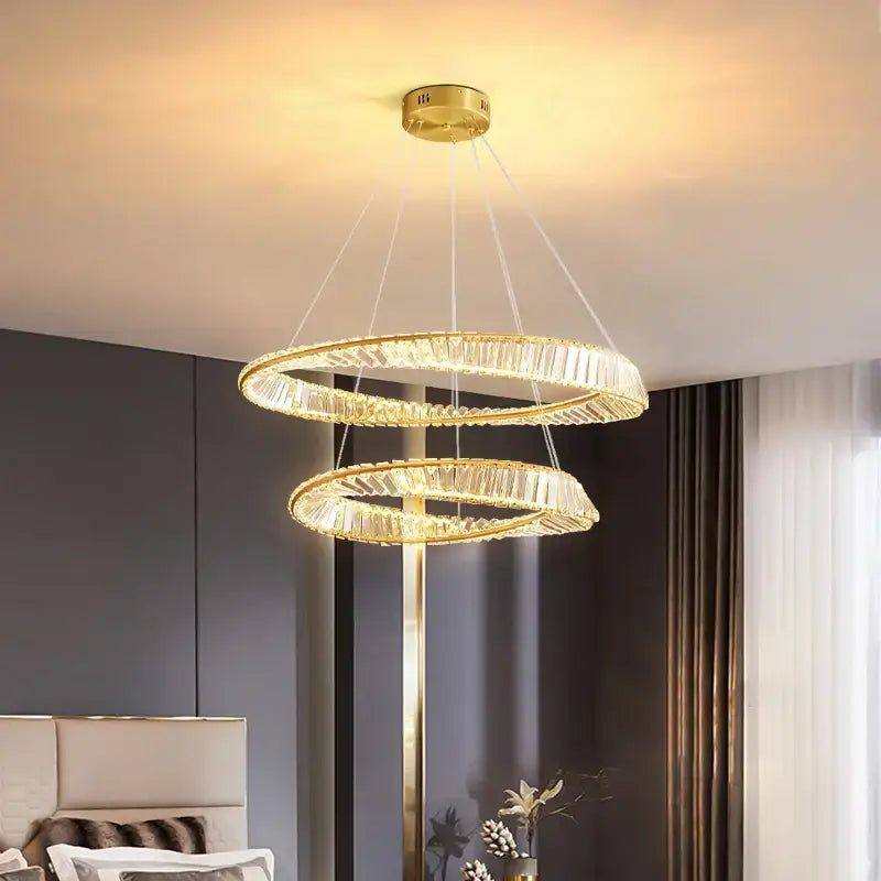 Gold-finished double-ring decorbites crystal chandelier with crystal accents for modern living and dining rooms