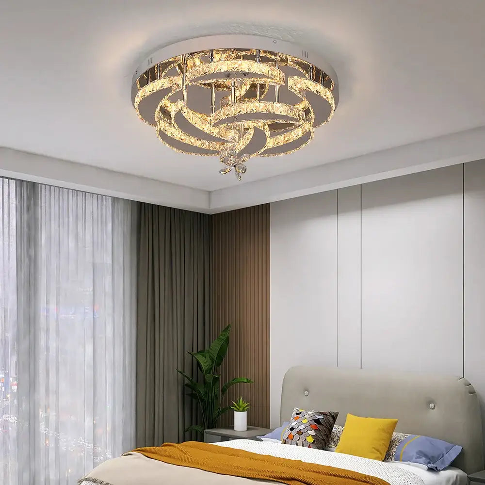 A modern decorbites crystal chandelier with concentric crystal rings and warm dimmable LED lighting for living rooms